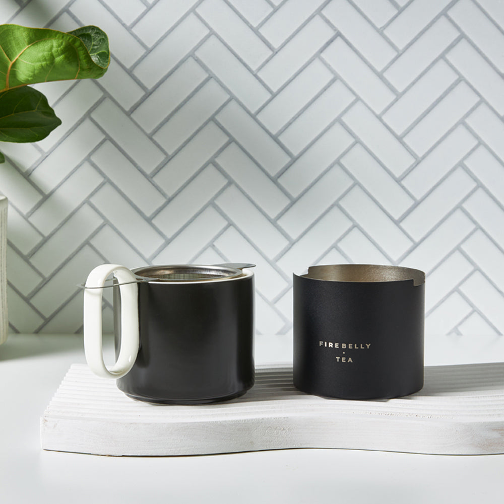 Close-up of the inside of a black thermos with a metal rim.