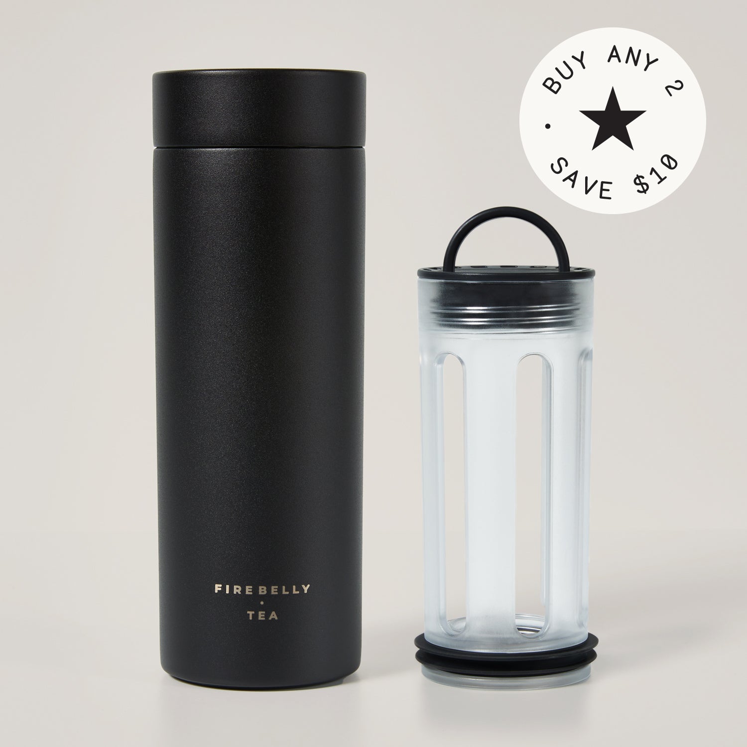 A sleek black travel tumbler with 'Firebelly Tea' branding and a discount promotion badge.